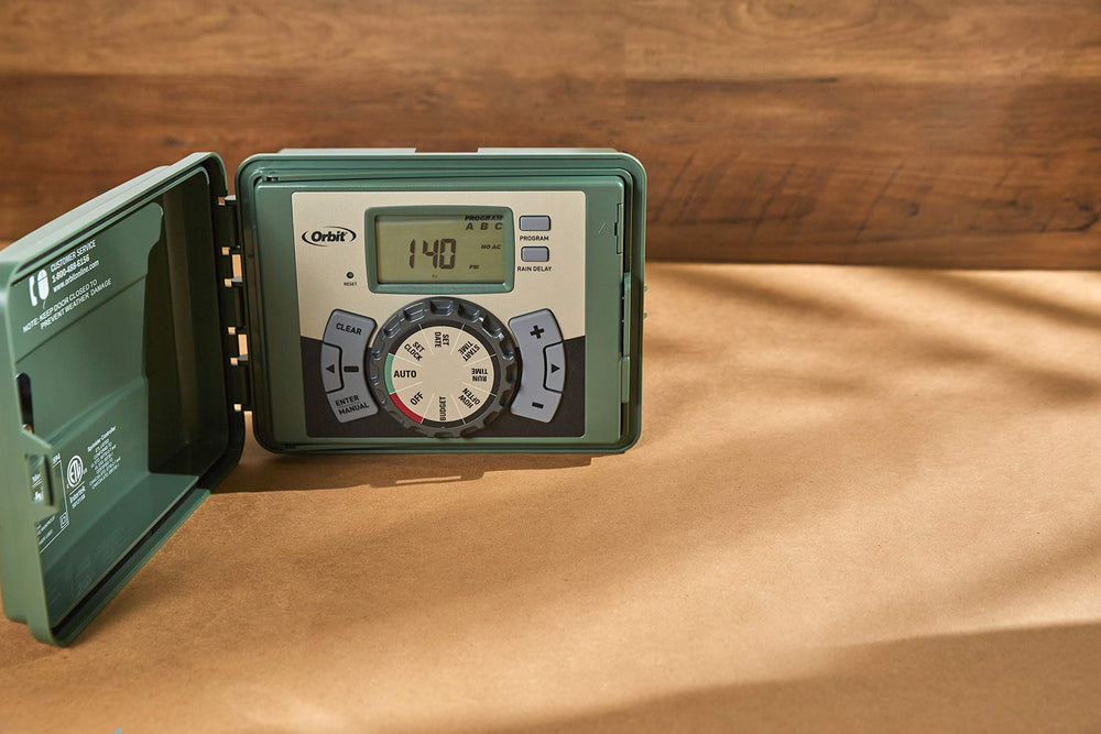 Orbit 4-Station Sprinkler Timer in garden setting