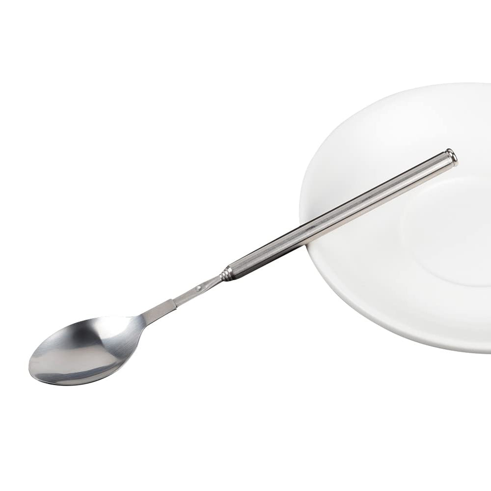 ORULA Extendable Spoon with a backdrop of outdoor cooking utensils