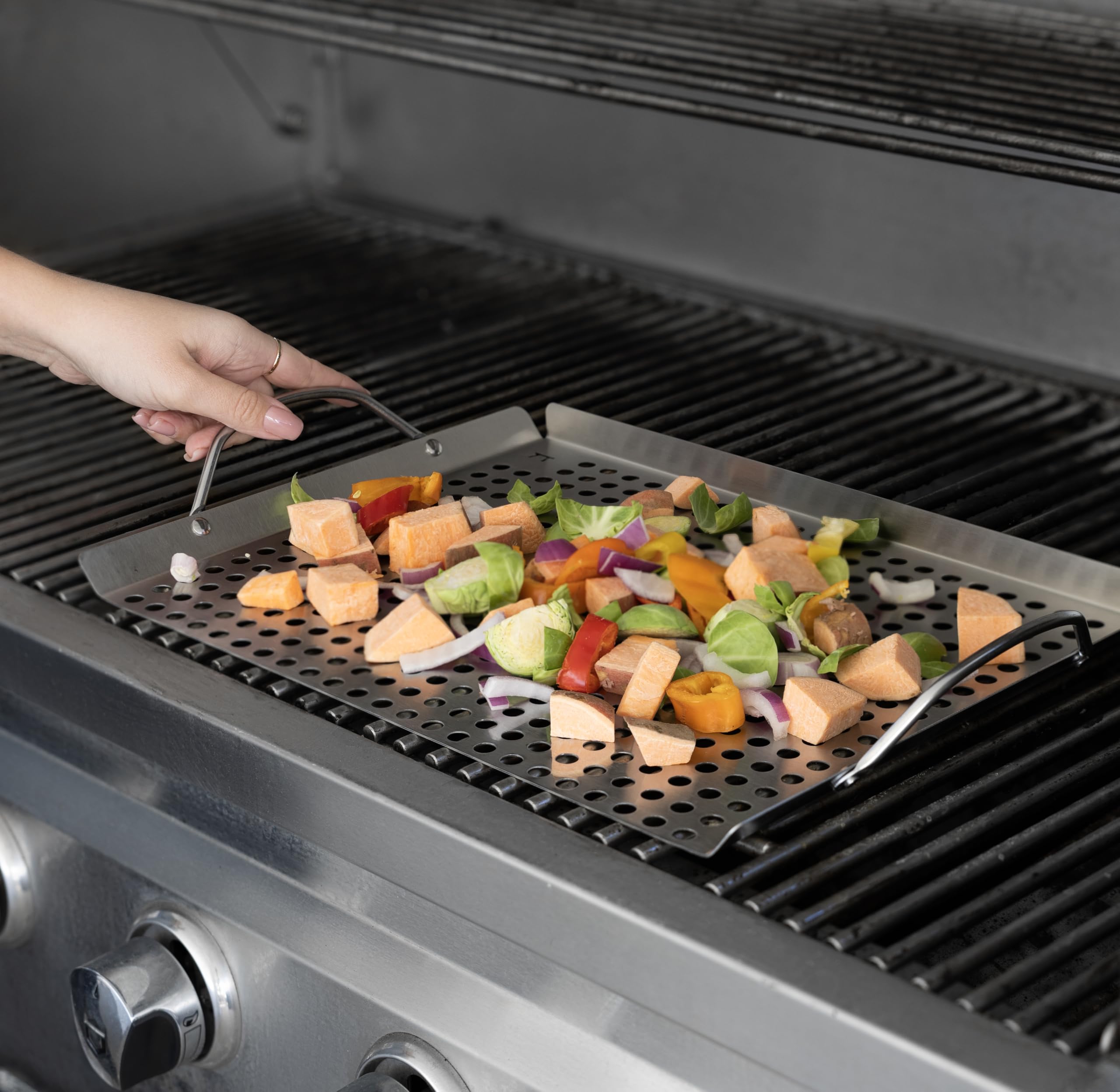 Outset grill topper set with shrimp and vegetables being grilled