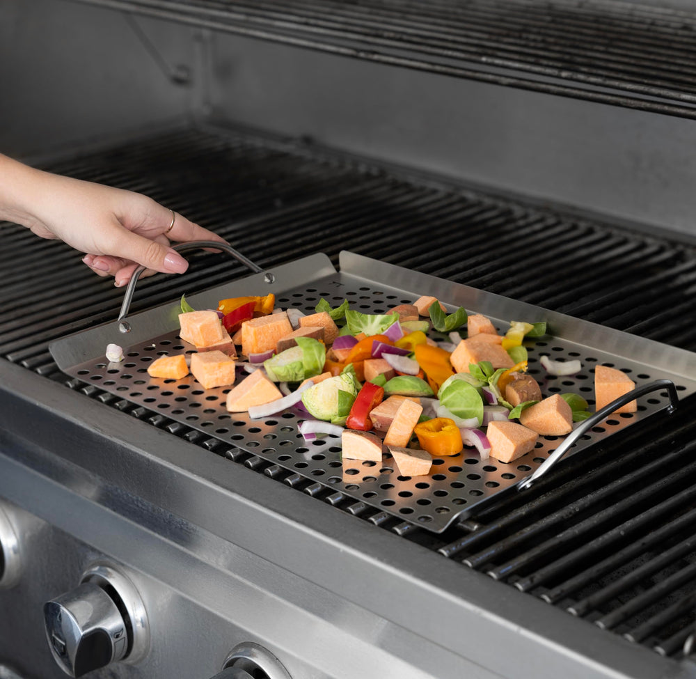Outset grill topper set with shrimp and vegetables being grilled
