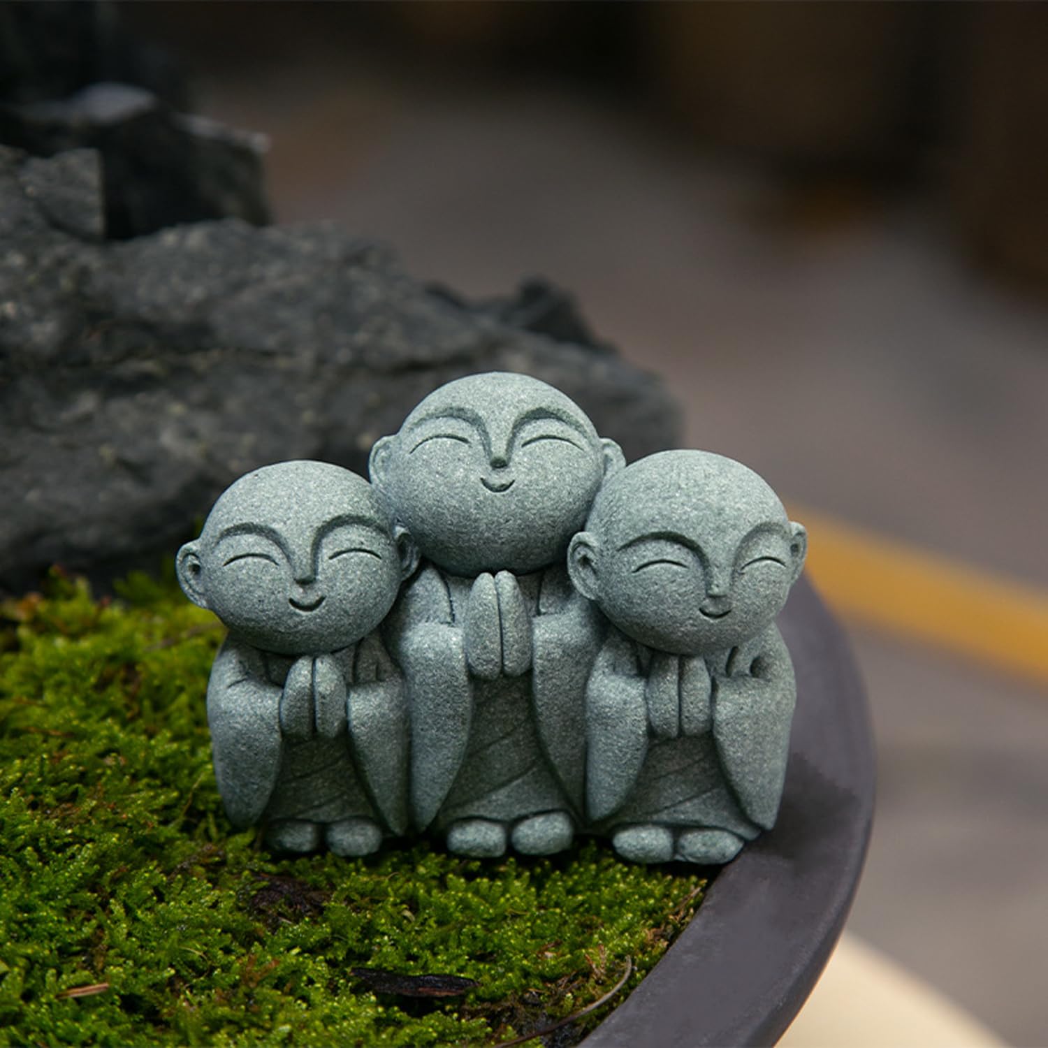 OwMell Jizo Monk Buddha Statue with flower pot background