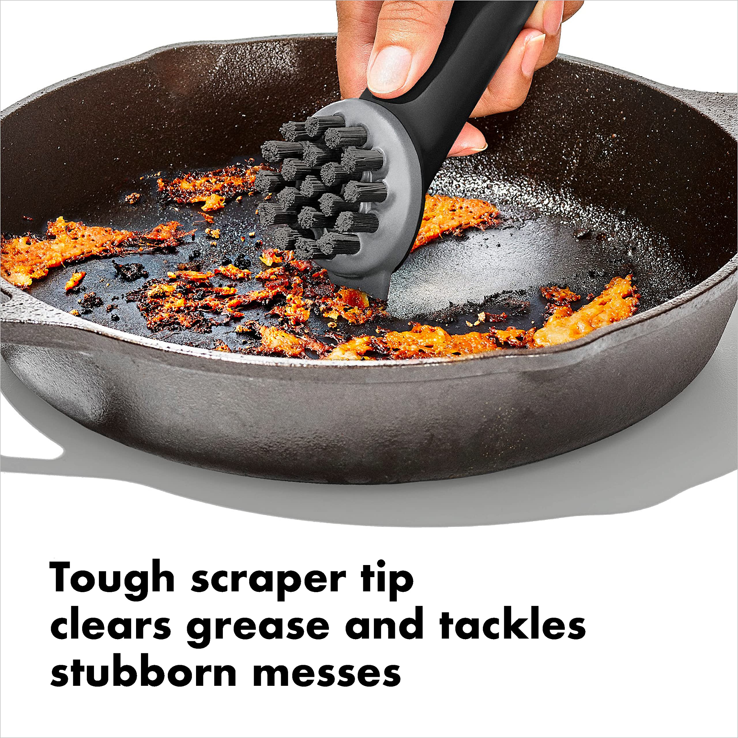 OXO Cast Iron Scrub Brush in use on cookware