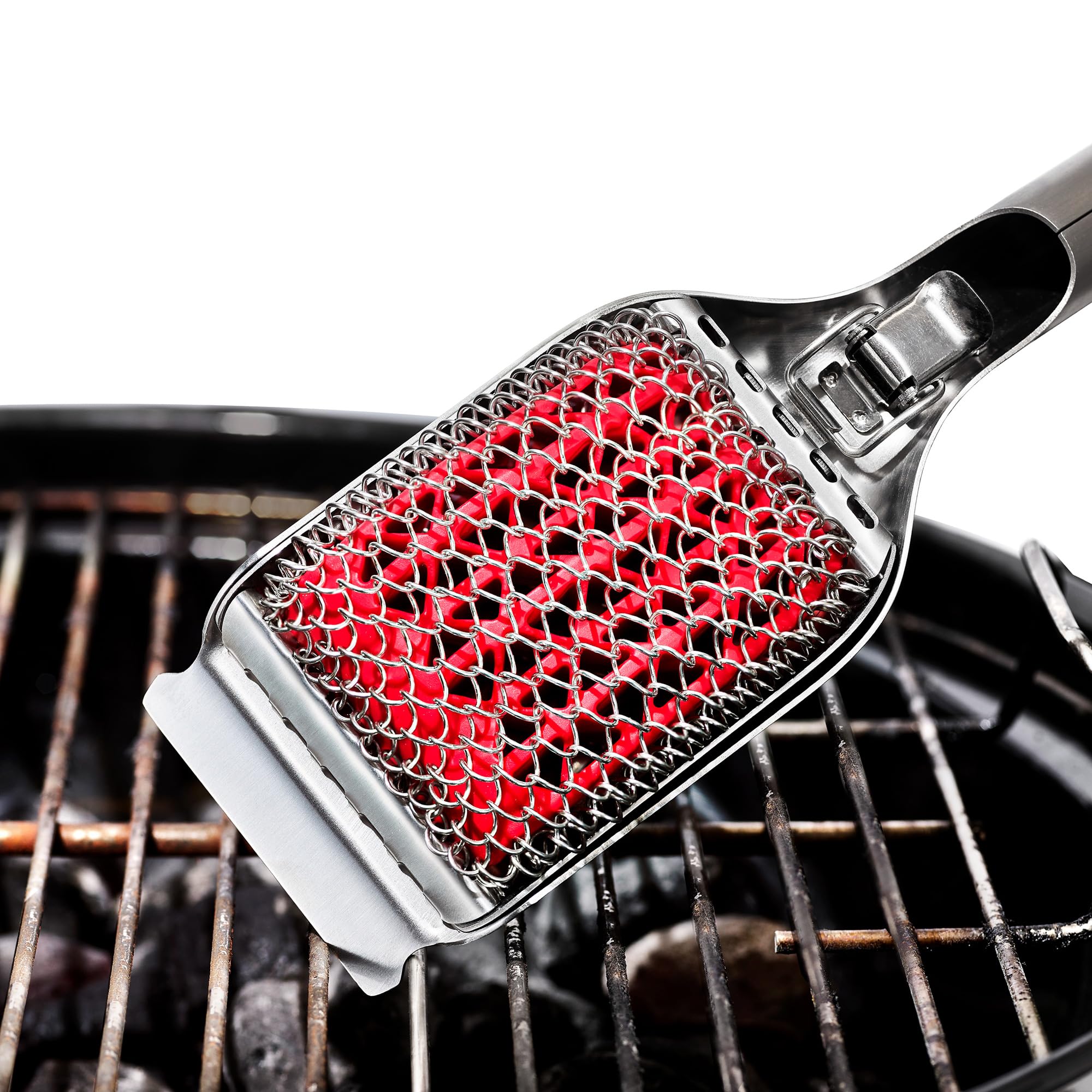 OXO coiled grill brush in use on a hot grill