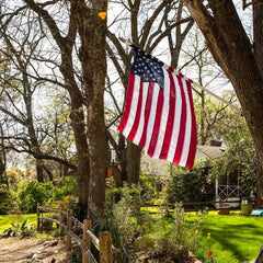 Pack of 12 American stick flags on a table