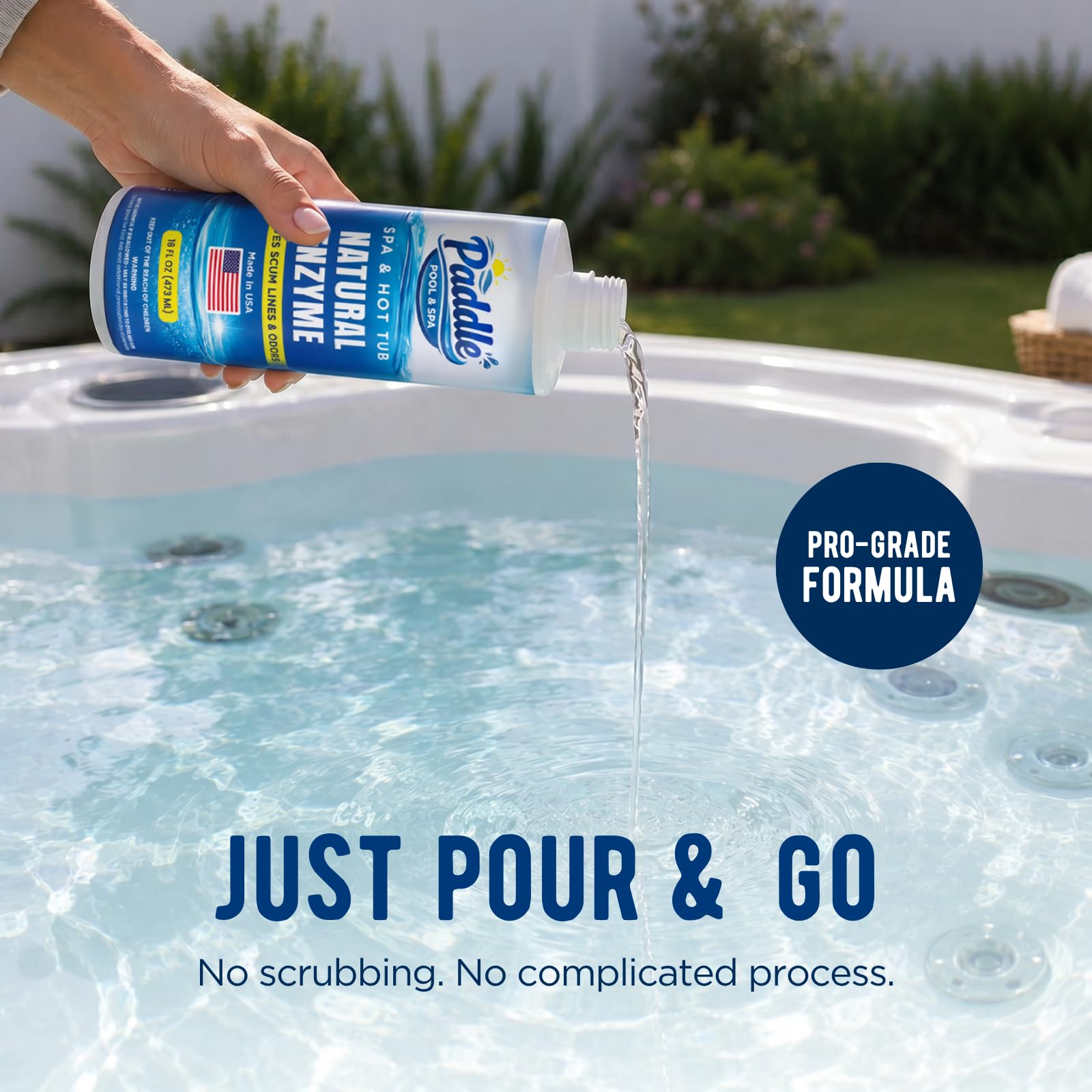 Paddle enzyme bottle surrounded by spa accessories
