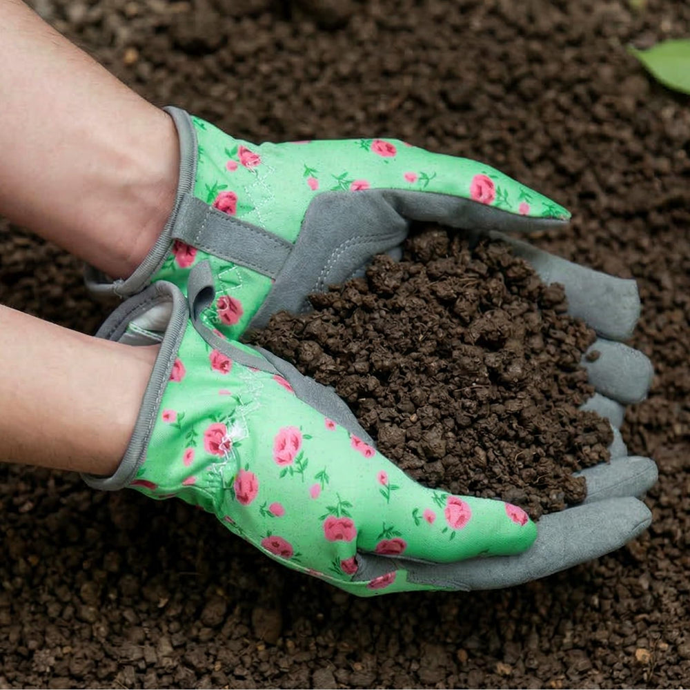 Pair of Baidast Gardening Gloves laid on a garden background