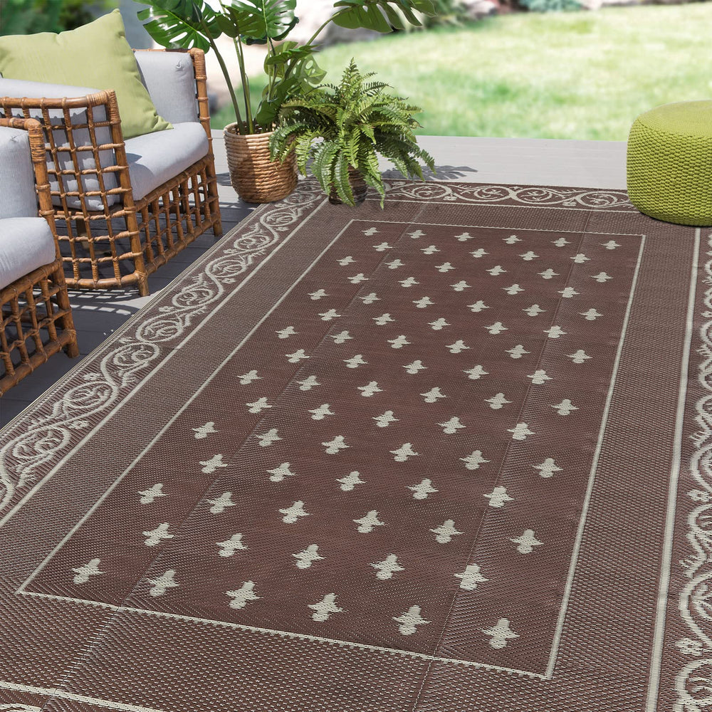 Pauwer Outdoor Rug 6x9 bordered brown front view