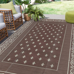 Pauwer Outdoor Rug 6x9 bordered brown front view