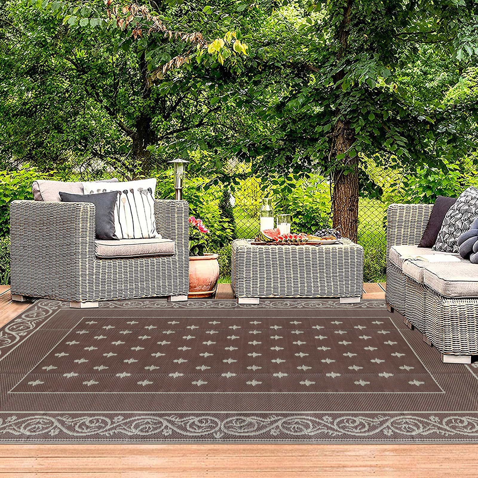 Pauwer Outdoor Rug 6x9 in a garden setting
