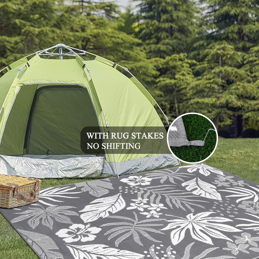 Pauwer Outdoor Rug 8x10 Floral Grey in a camping setting