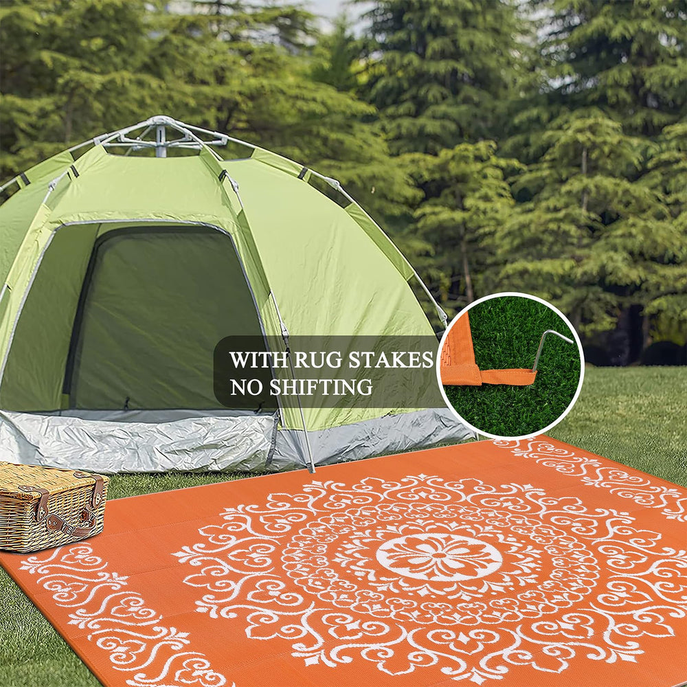 Pauwer Outdoor Rug 8x10 Floral Orange on patio