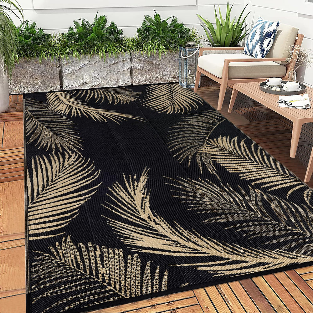 Pauwer Outdoor Rug 8x10 with rug stakes on grass