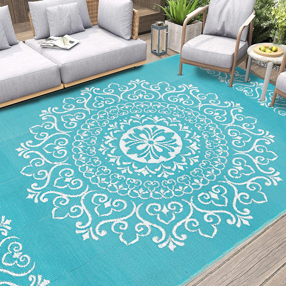 Pauwer Outdoor Rug 9x12 Floral Teal close-up of fabric