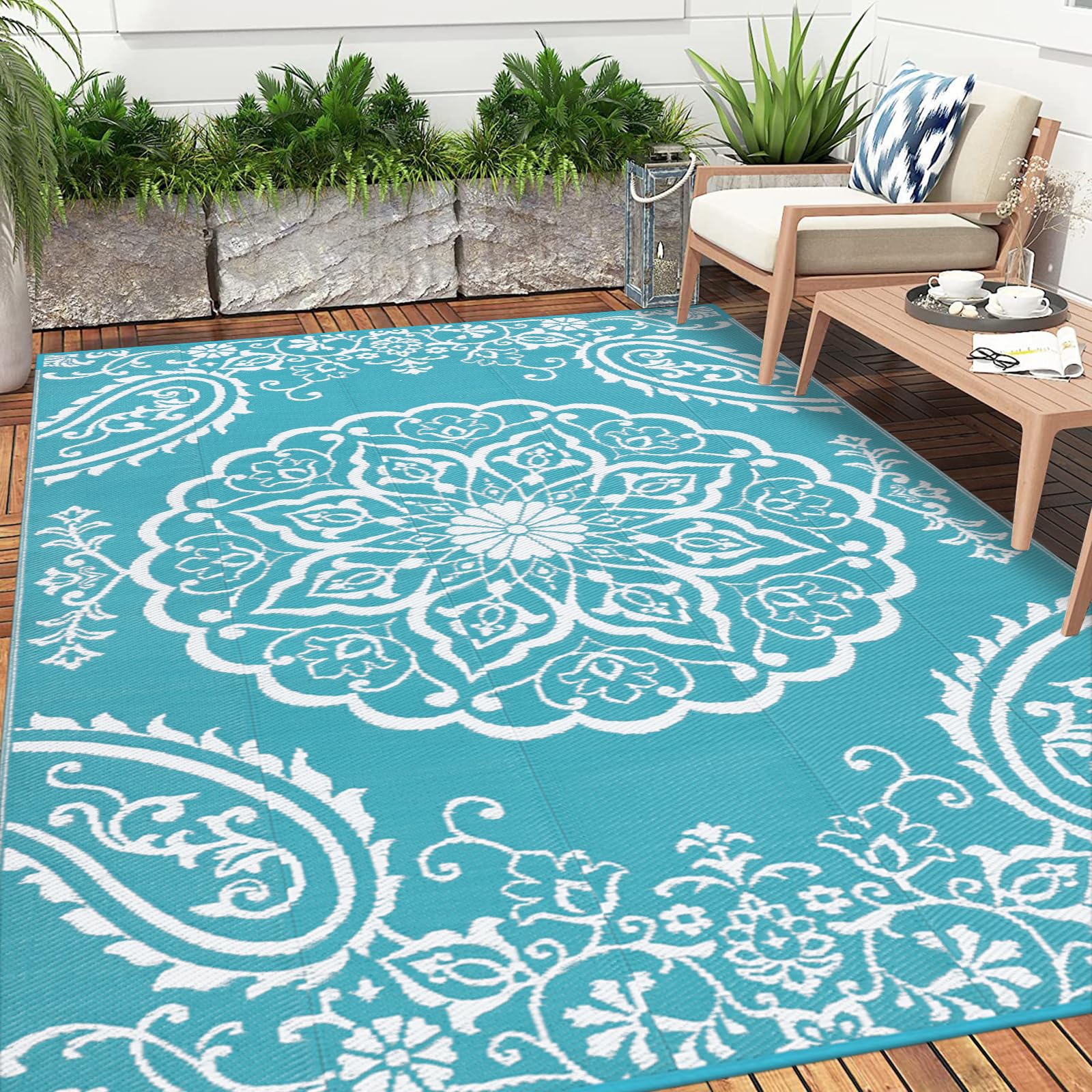 Pauwer Outdoor Rug laid out in a garden setting