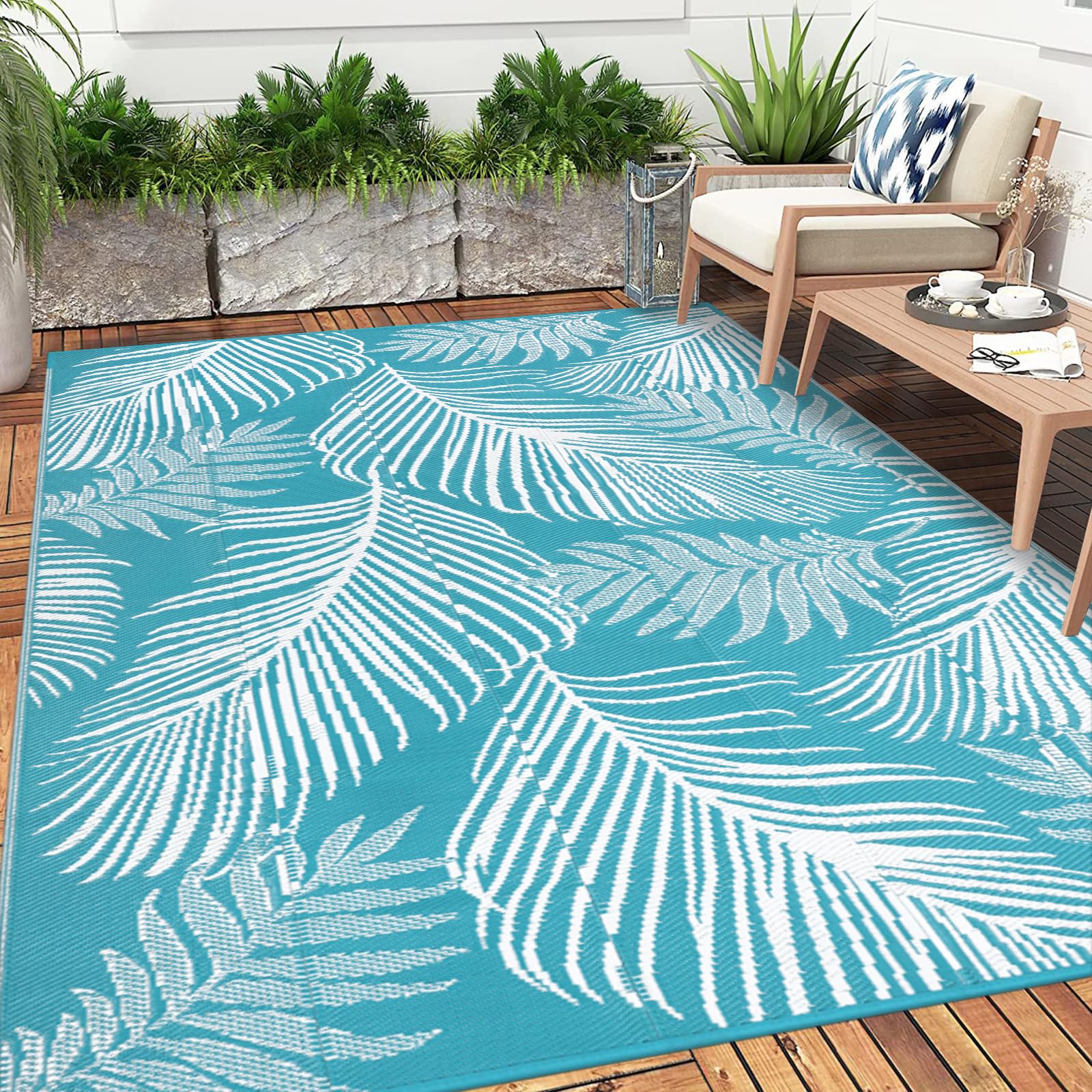 Pauwer Outdoor Rug Leaf Teal in a picnic setting