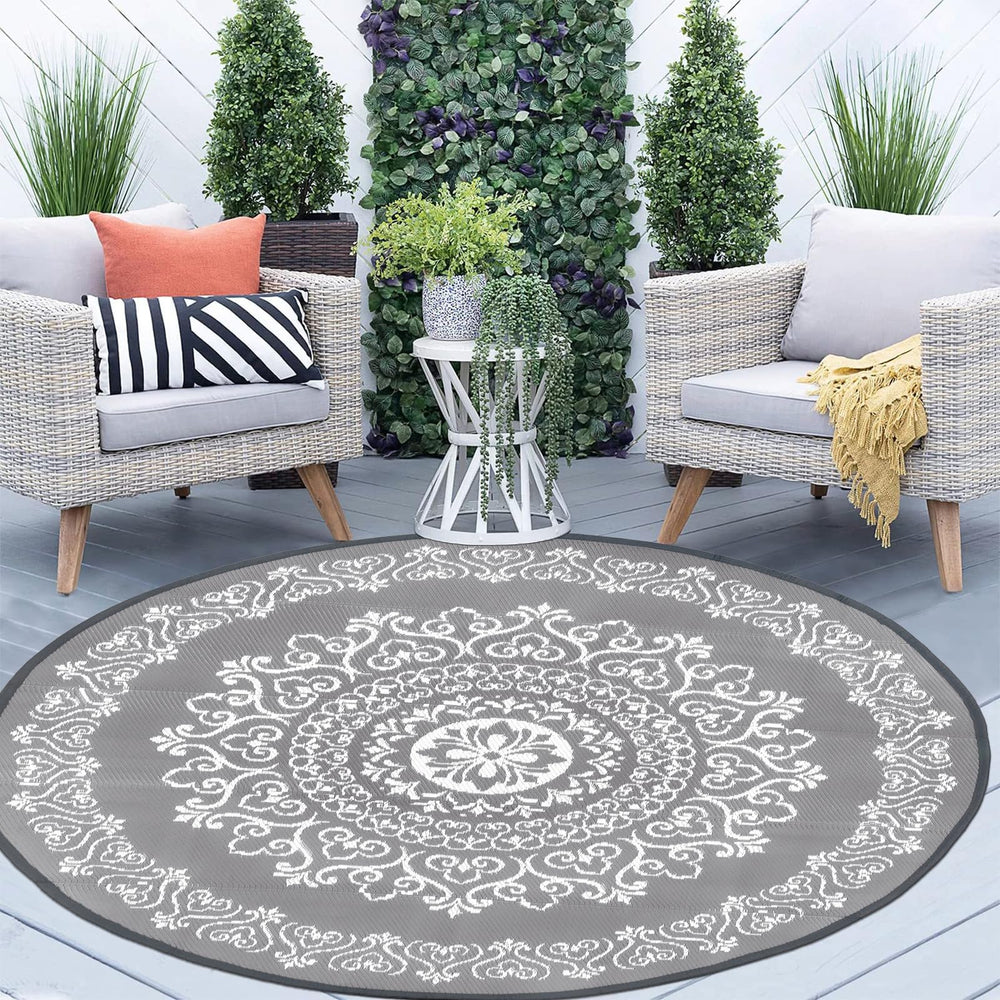 Pauwer Outdoor Rug with stakes for secure placement