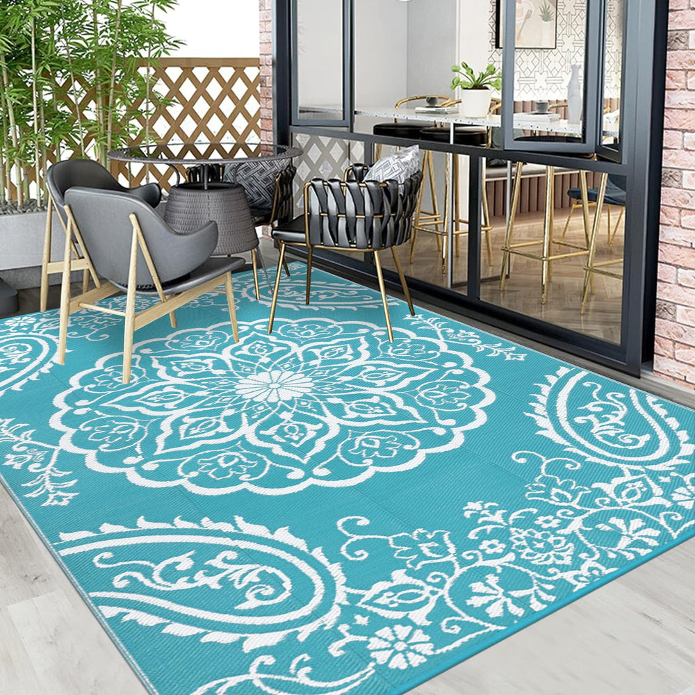 Pauwer Outdoor Rug with stakes for secure placement