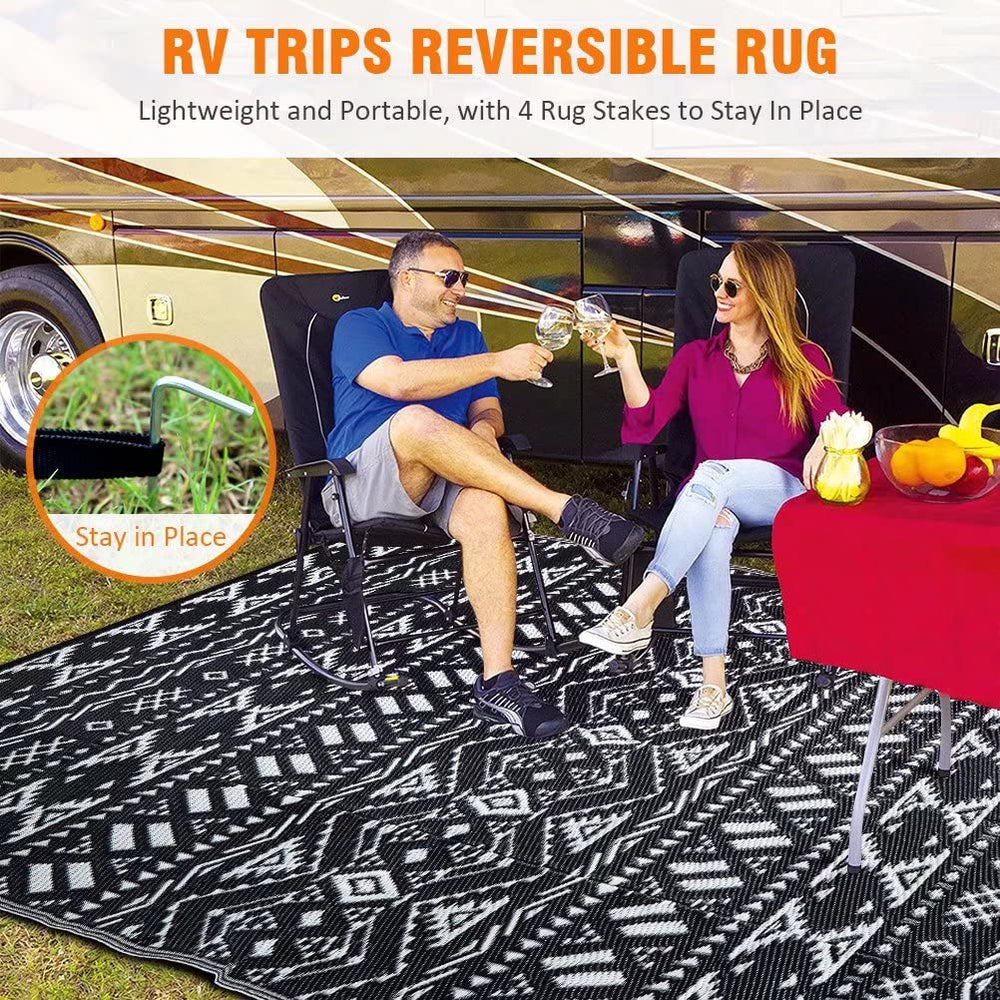 Pendolr Outdoor Rug 9'x12' laid out at a beach