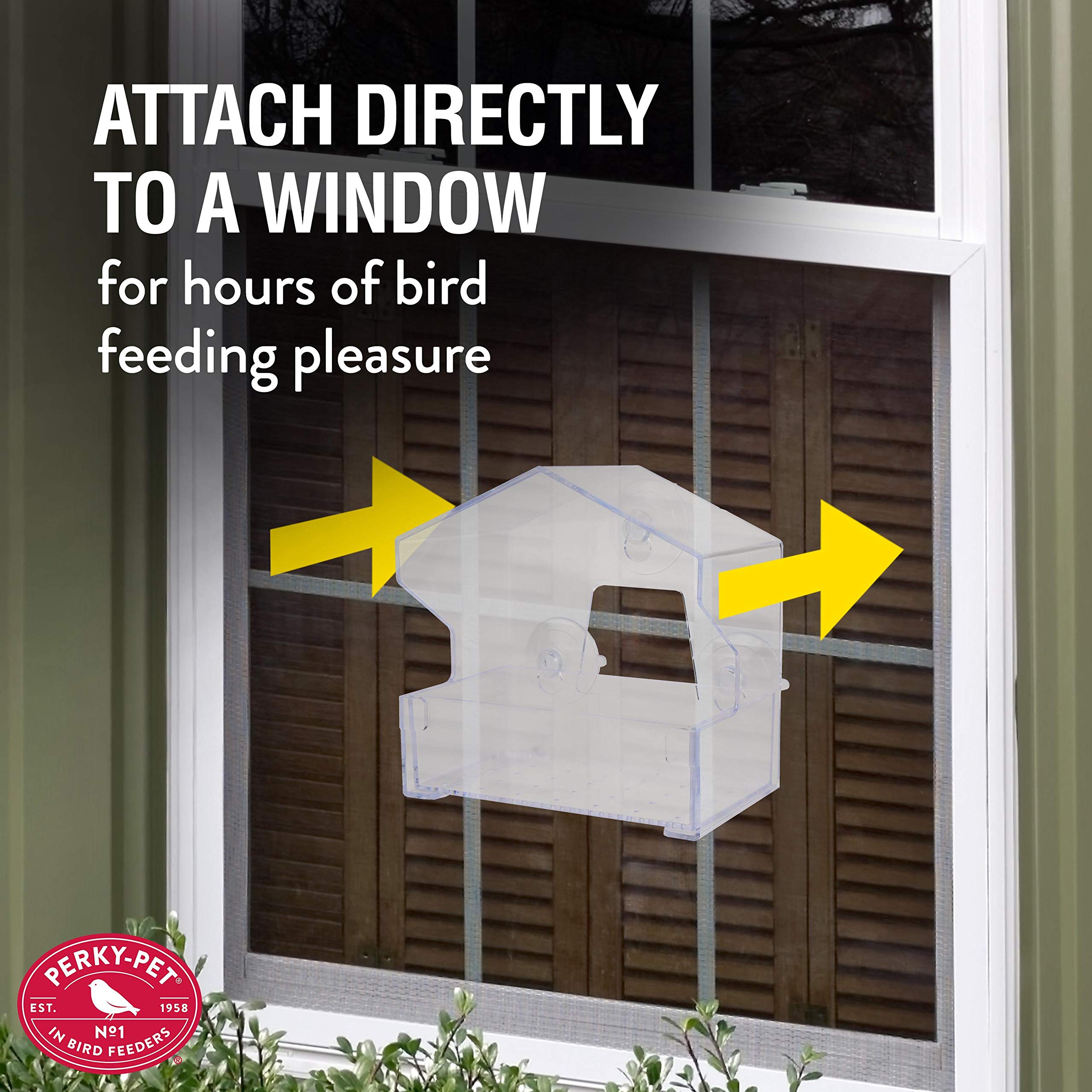 Perky-Pet Window Bird Feeder filled with birdseed