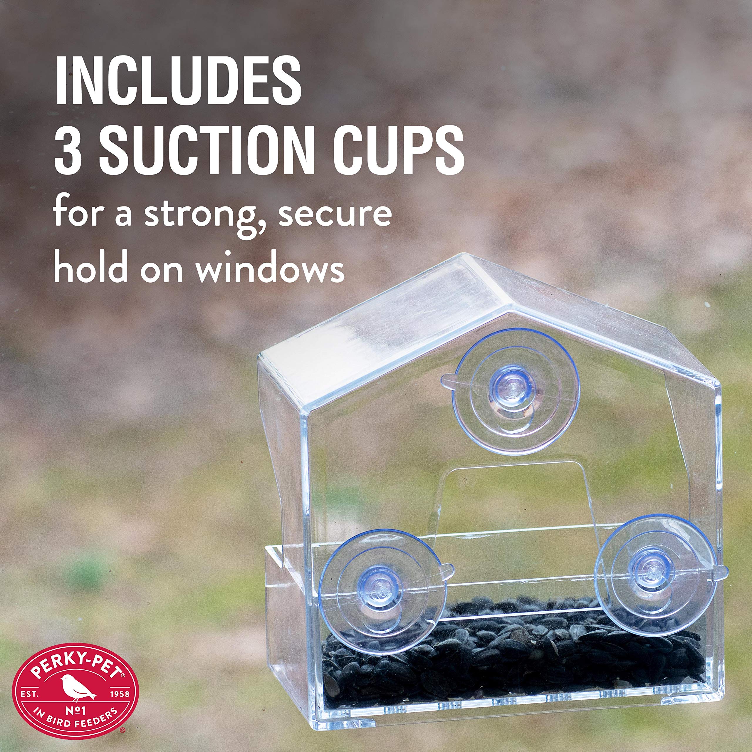 Perky-Pet Window Bird Feeder with birds in the background