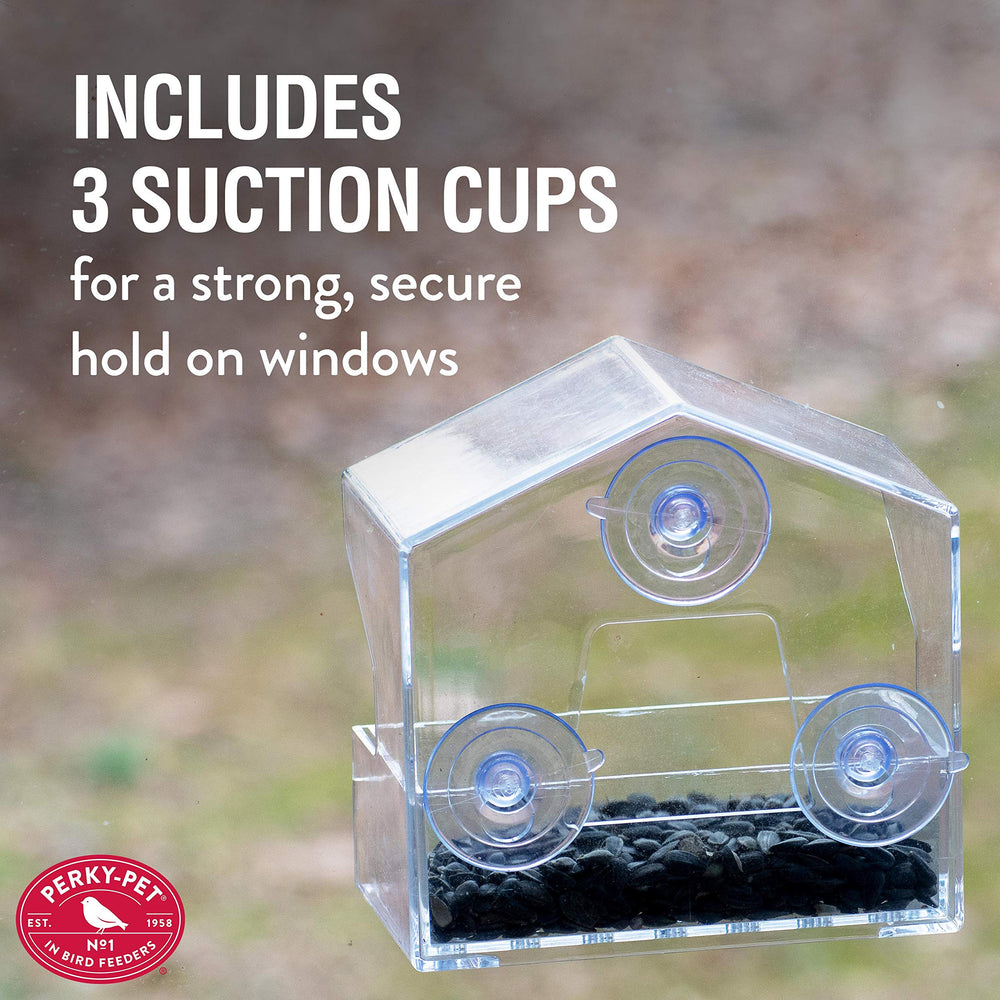 Perky-Pet Window Bird Feeder with birds in the background