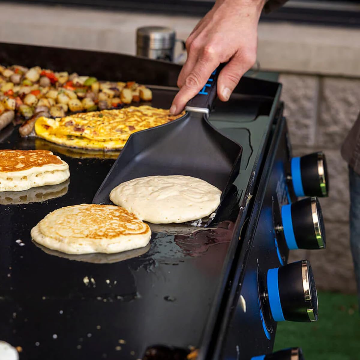 PIT BOSS Griddle Grub Shovel hanging on tool hook for storage