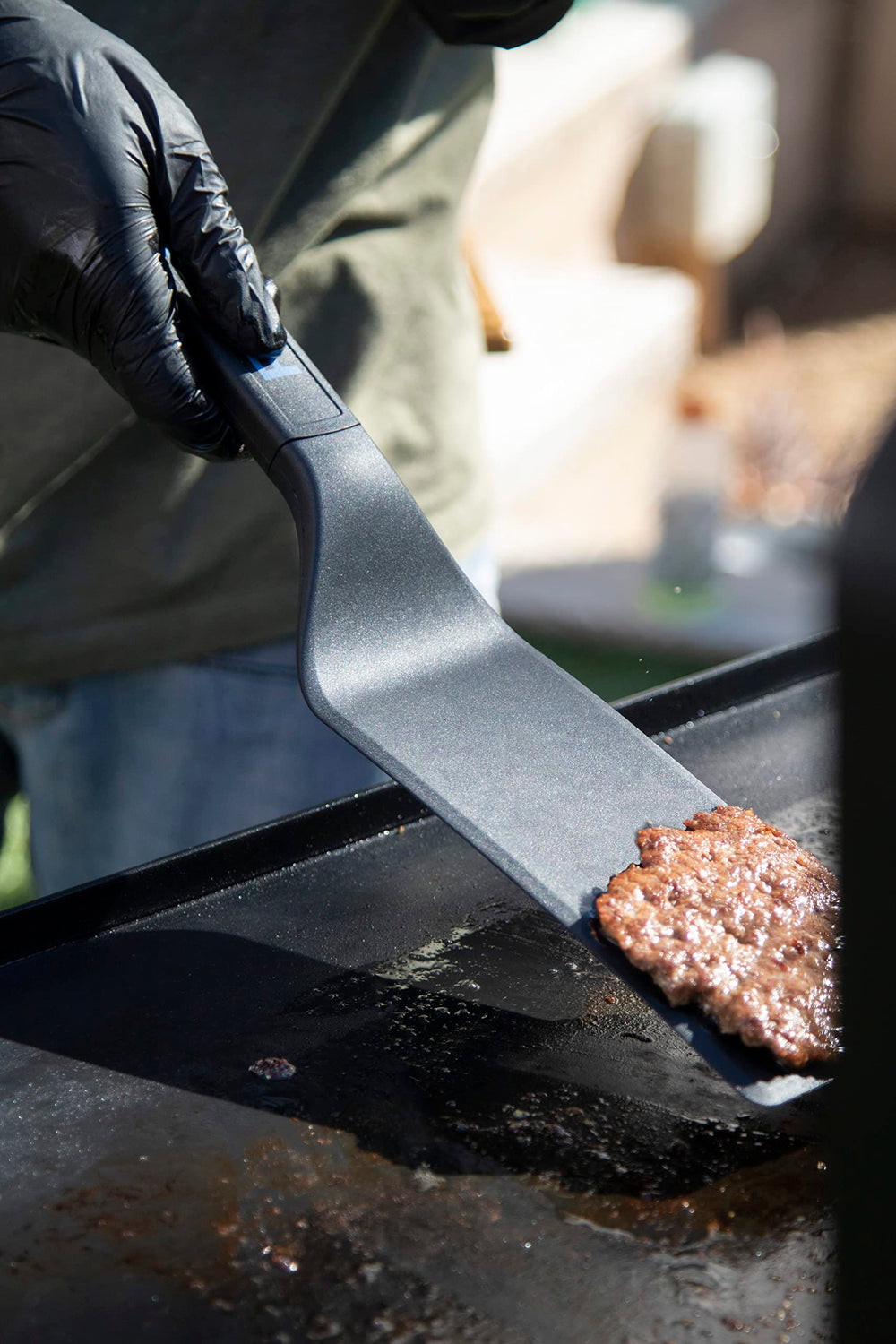PIT BOSS griddle tools being used for outdoor cooking