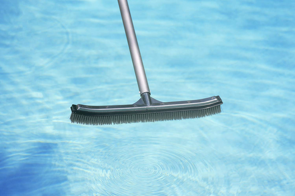 Poolmaster brush in action cleaning a pool wall