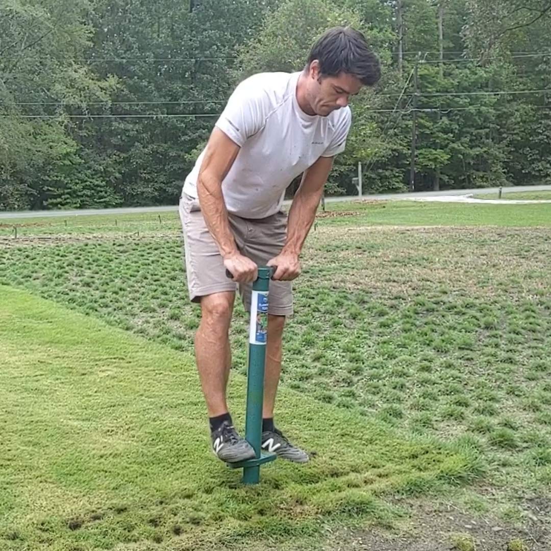 ProPlugger 5-IN-1 Lawn Tool showing soil storage feature
