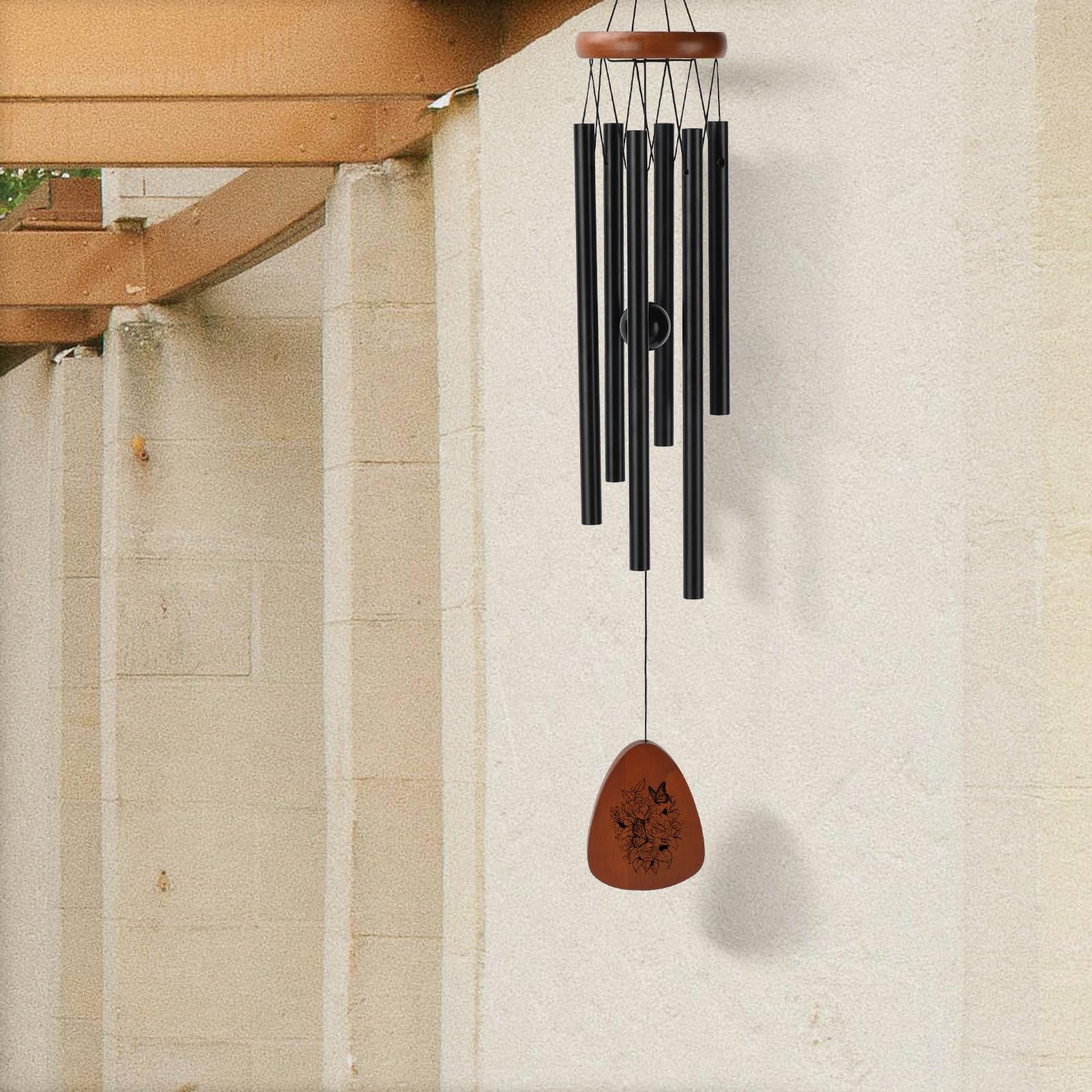 PRSTENLY wind chimes displayed on a porch