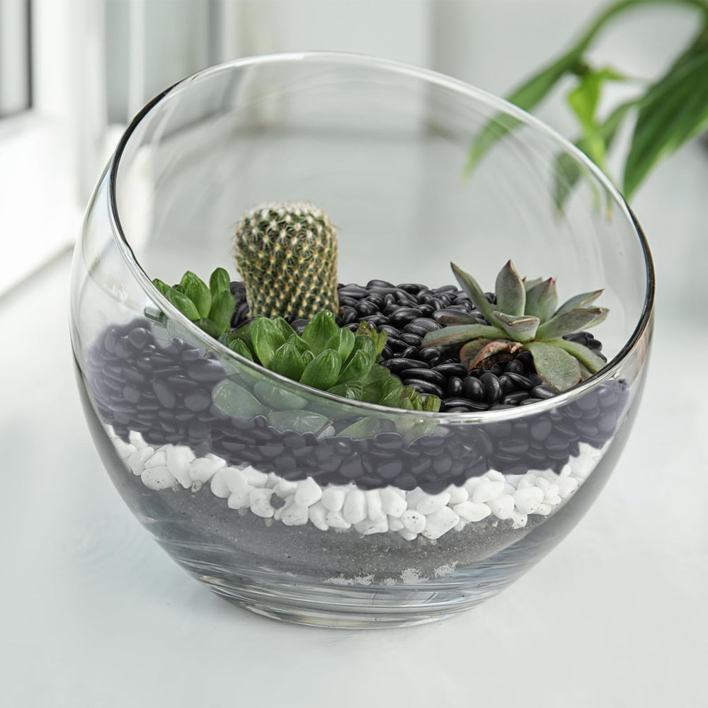 Pulovin black pebbles displayed in a garden setting