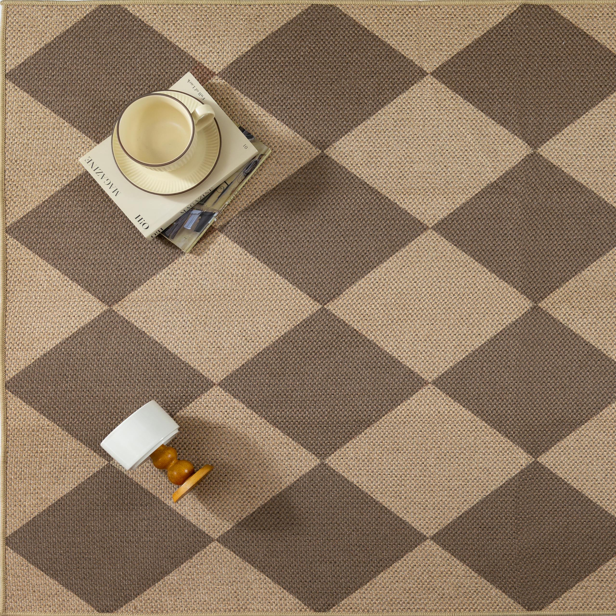 PureCozy 2x3 Brown Checkered Area Rug being cleaned with a vacuum
