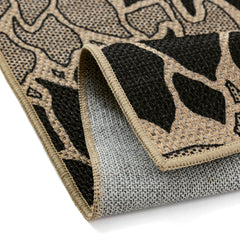 PureCozy 5x8 Black Outdoor Rug on patio