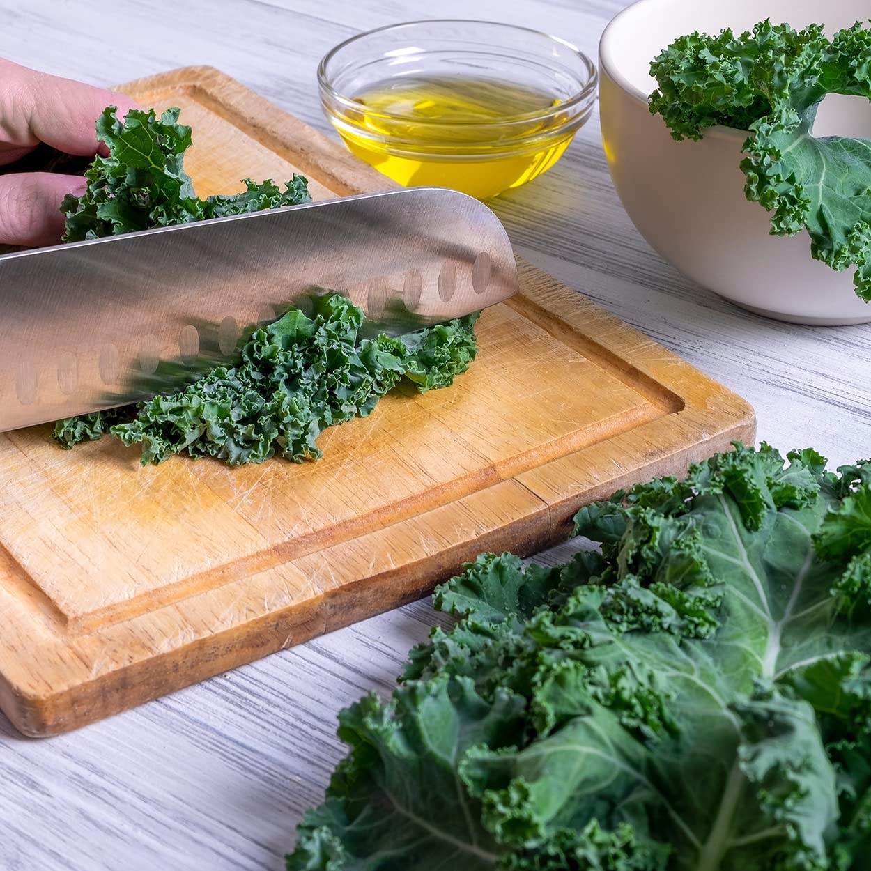 Purely Organic Kale Seeds on a wooden table with gardening tools