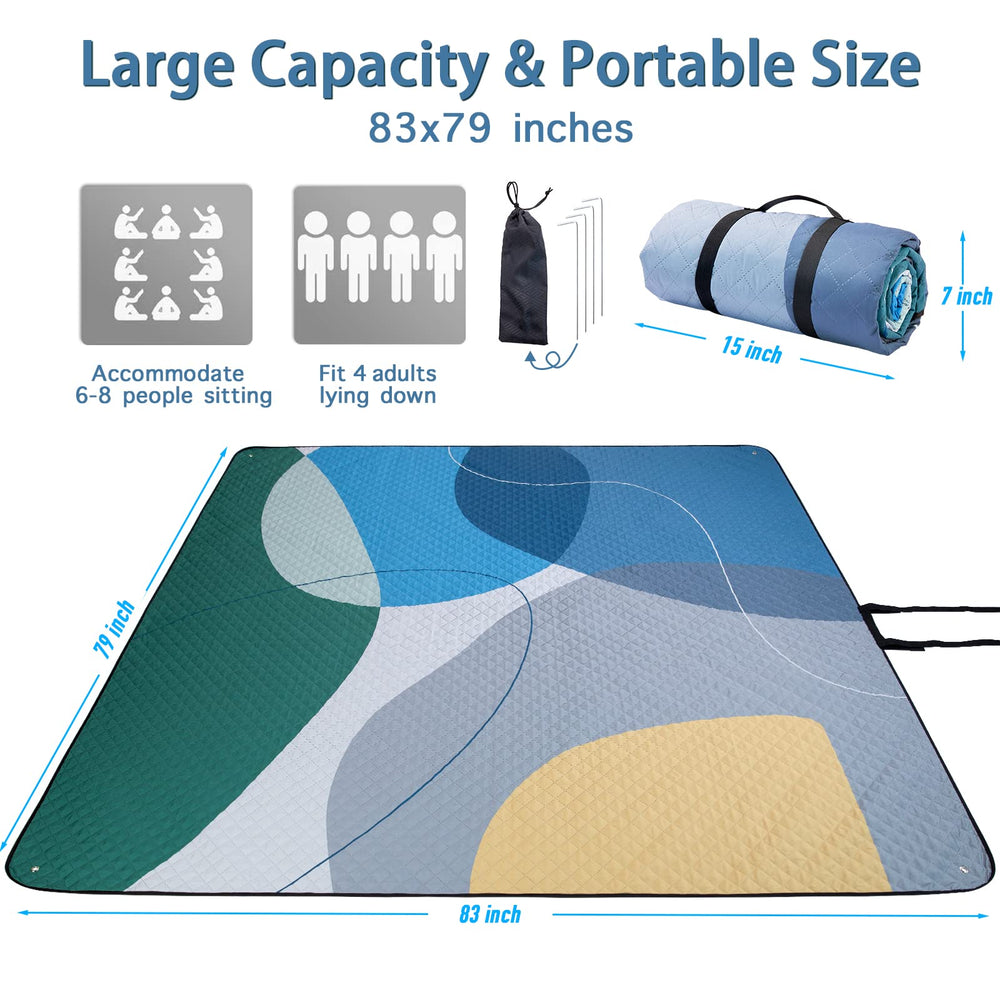 PY SUPER MODE picnic blanket laid out on grass, with food and drinks