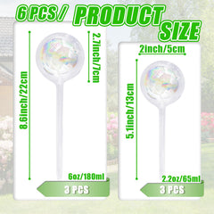Pynqdfu small iridescent glass watering globe next to a plant
