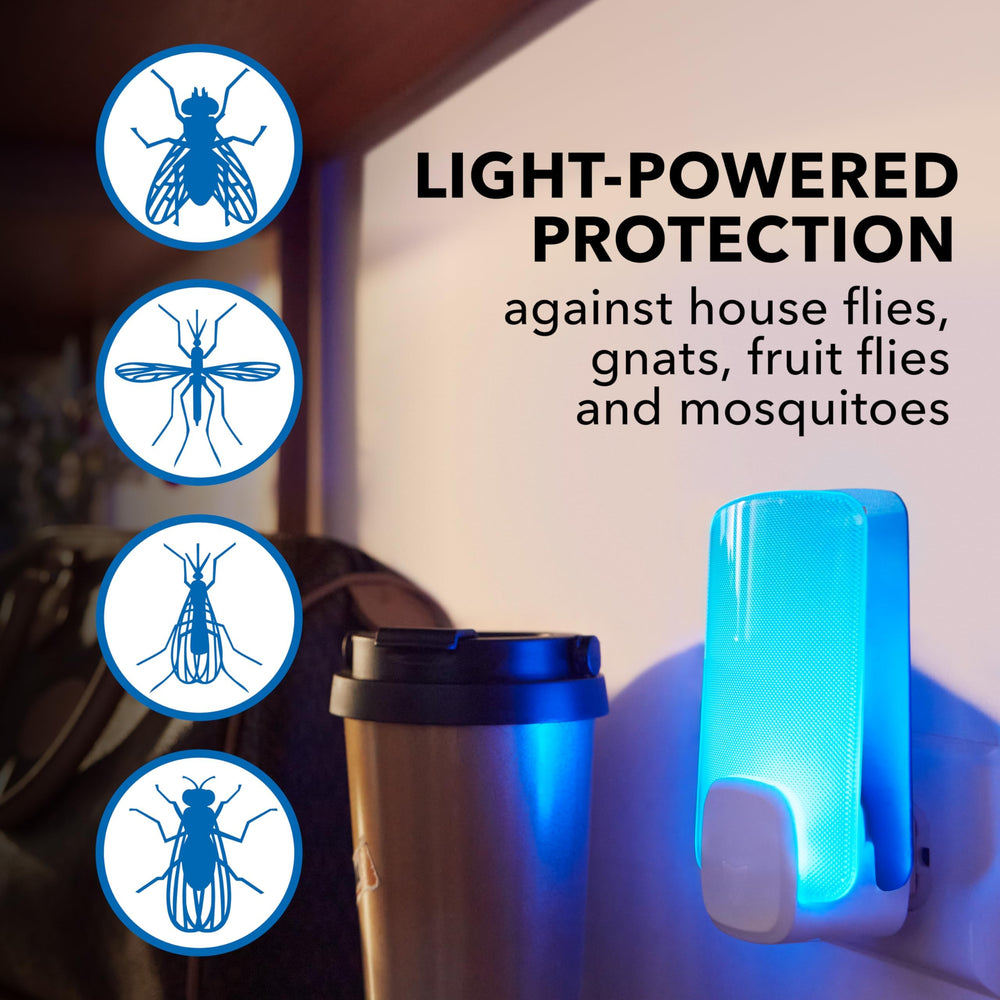 Raid Flying Insect Light Trap plugged into wall outlet