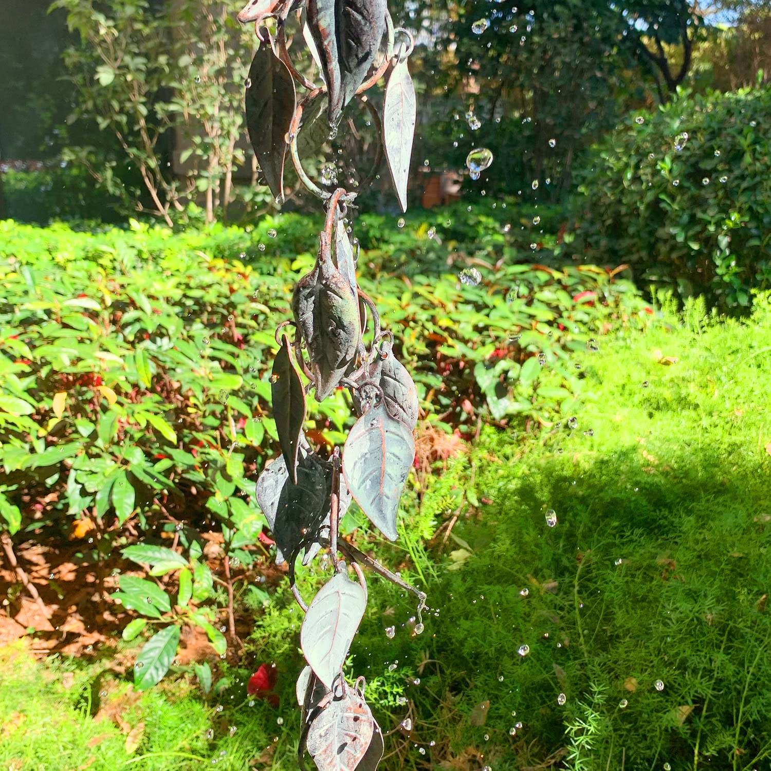 Rain cascading down Aifeorzo metal rain chain