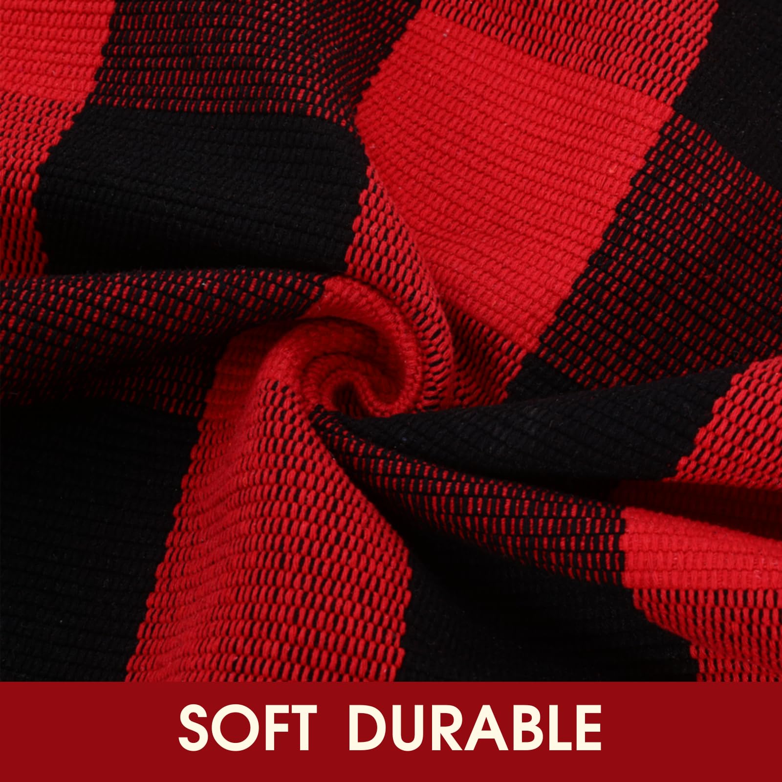 Red and black plaid rug layered with a doormat at entryway