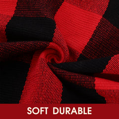 Red and black plaid rug layered with a doormat at entryway
