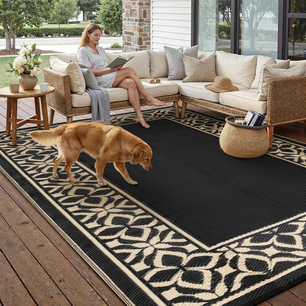 Reversible side of PureCozy outdoor rug in black beige geometric