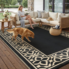 Reversible side of PureCozy outdoor rug in black beige geometric