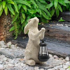 REYISO bunny statue in garden setting with flowers