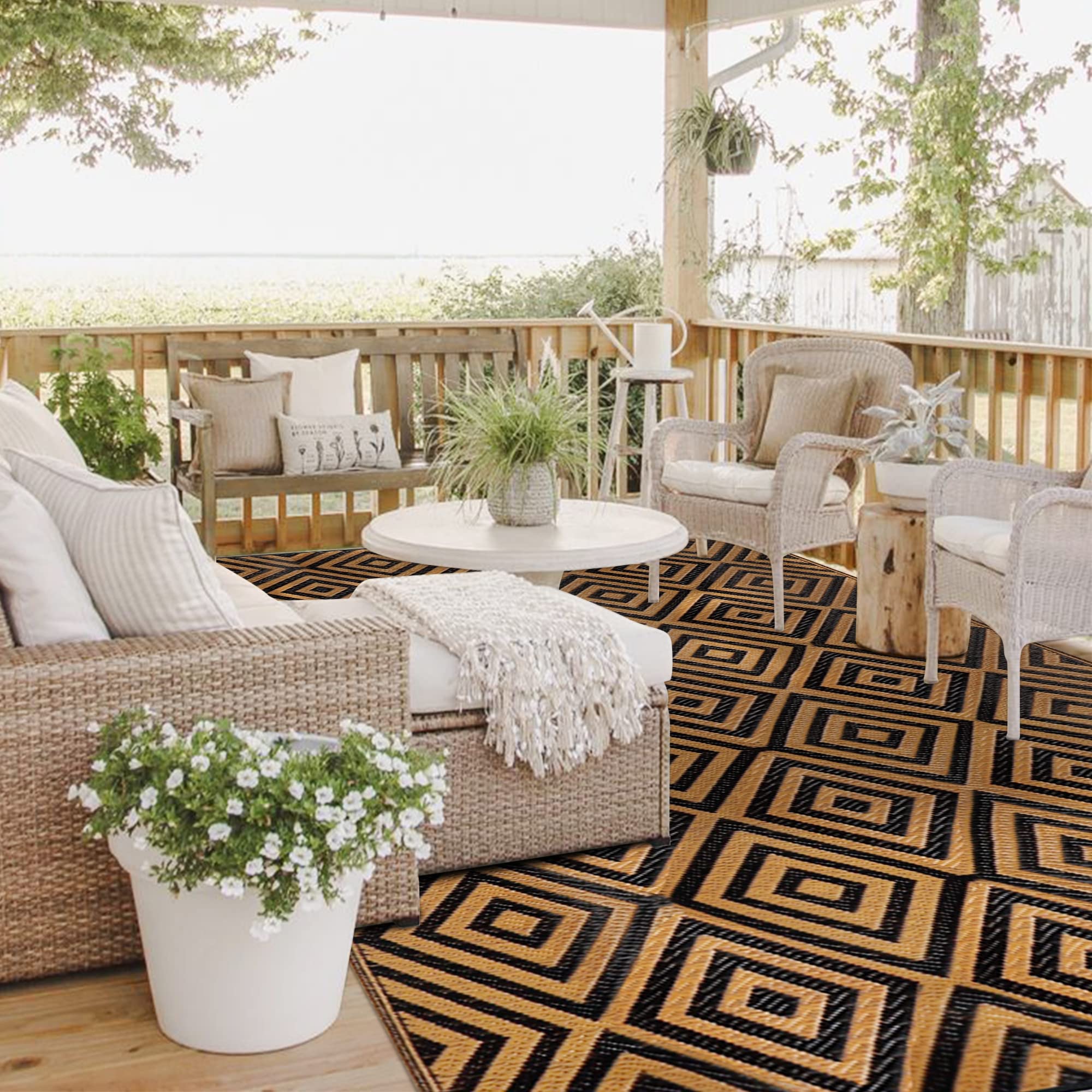 Ridota Outdoor Rug with corner loops and stakes visible