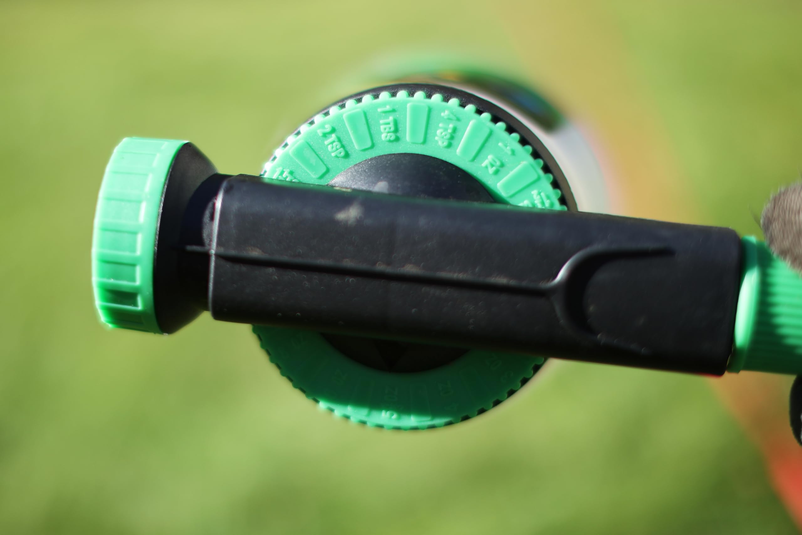 RL Flo-Master Chameleon Hose End Sprayer in use in a garden