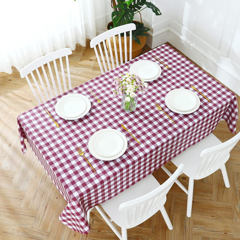 Romanstile tablecloth on a dining table with tableware