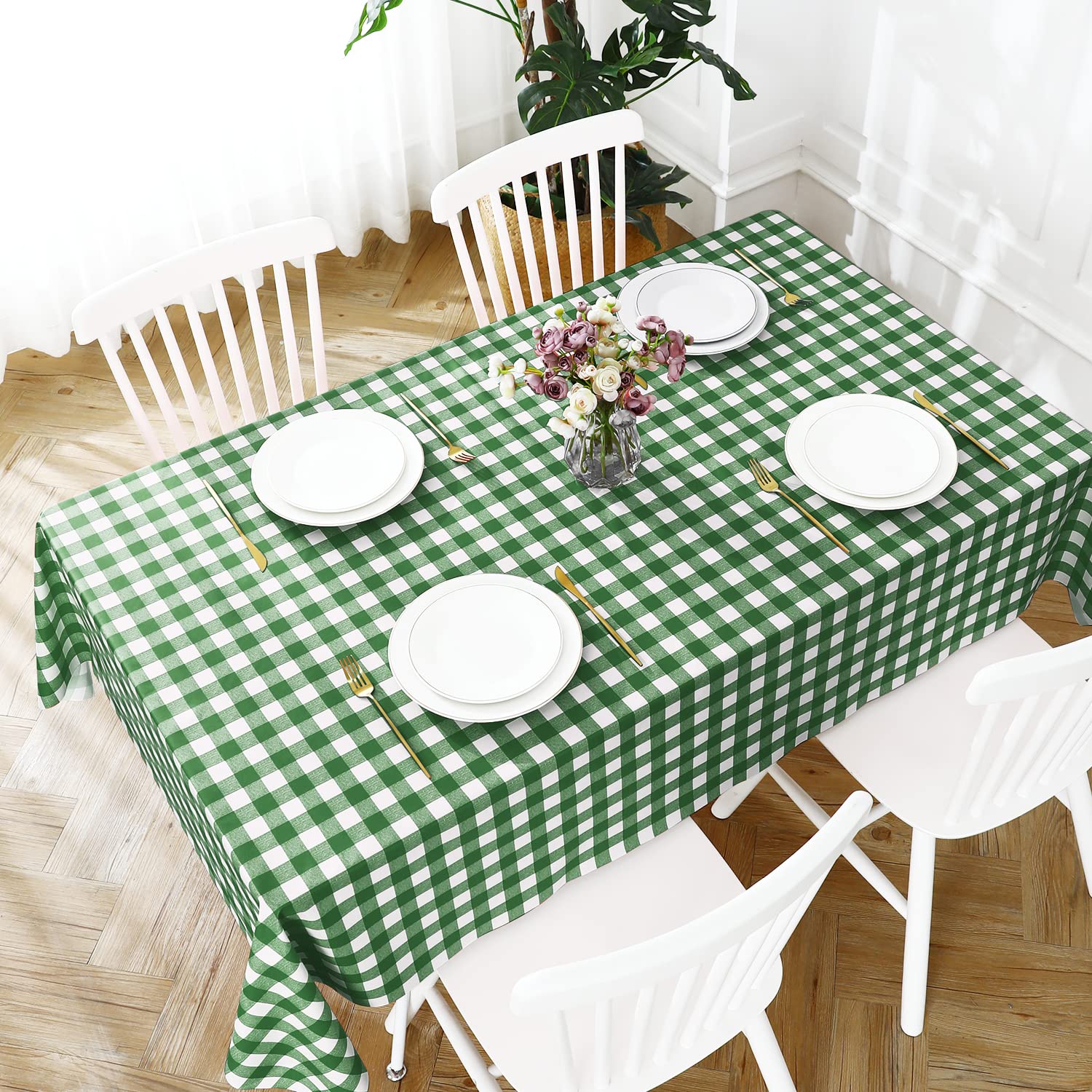 Romanstile vinyl tablecloth folded showing its green and white pattern