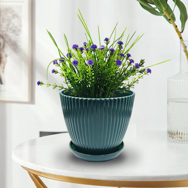 RooTrimmer pots in dark green colour, on a balcony with plants