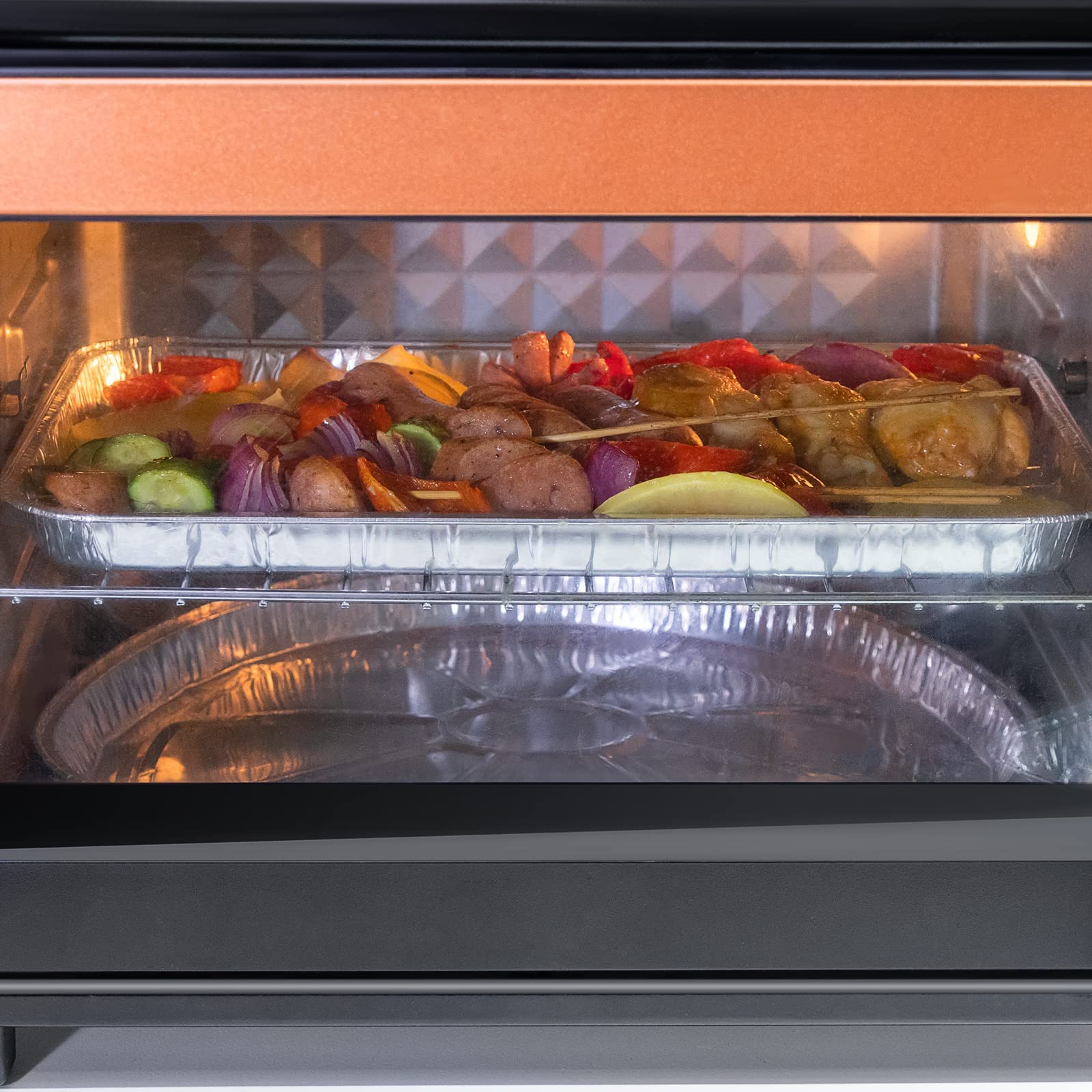 Roponan grill topper in use with vegetables on a grill