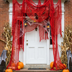 RunNico red gauze draped over a porch railing